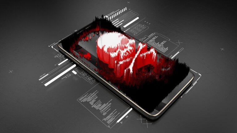 Red pirate skull on smartphone screen, mobile hacking, system breach, virus