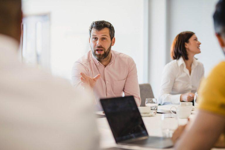 Security Analyst in a team meeting.