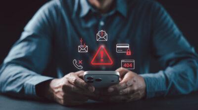 Man using smartphone virtual red cybersecurity warning icons Phishing, Call scam, Credit card fraud, 404 Error for online safety concept, OTP fraud, Attack Crime, Spyware Blacklist, Protection Crisis